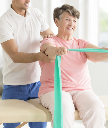 Physio helping woman