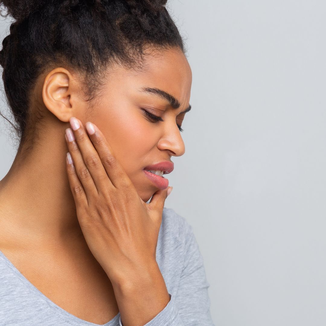 woman with jaw pain